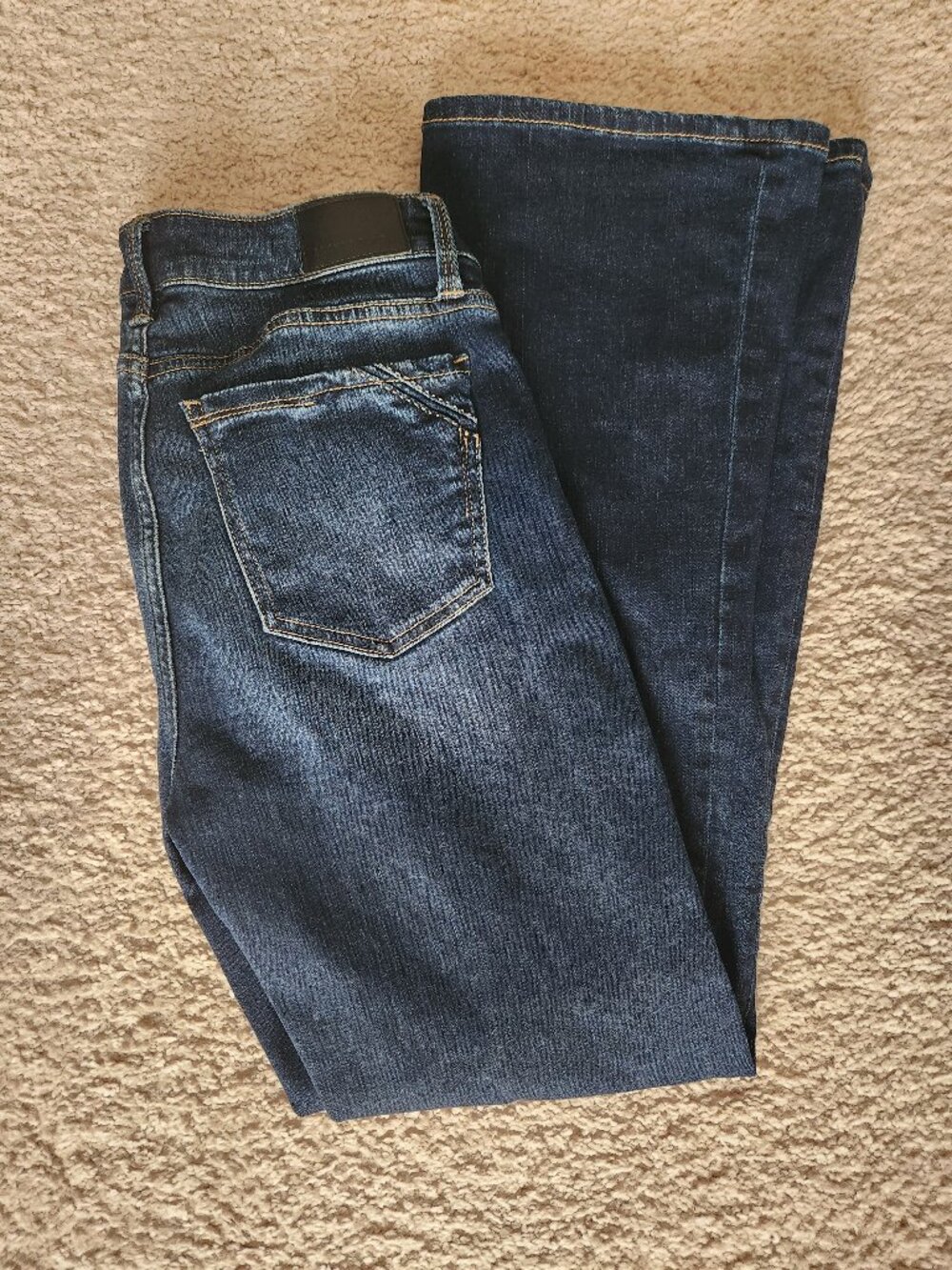 Buckle black bootcut jeans